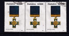 ZIMBABWE.... 2004 Medals $13000 strip of 3 used