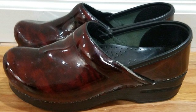 dansko patent clogs