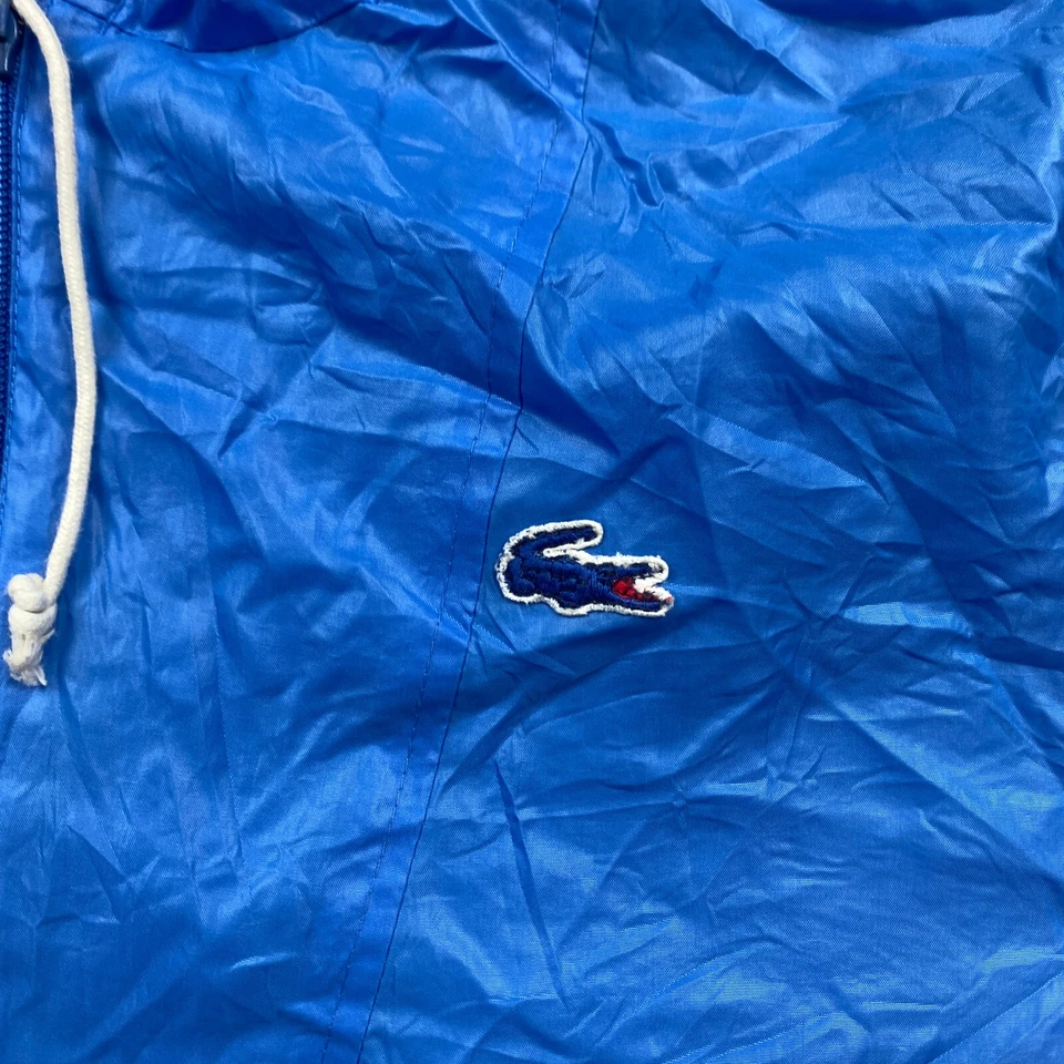 Chaqueta de lluvia vintage Lacoste para dama grande azul cocodrilo abrigo con capucha IZOD para mujer Foto 3 de 4