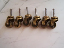 6 VINTAGE BASSICK METAL W/ BRASS FINISH SWIVEL CASTER WHEELS 1" WHEELS