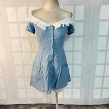 Reformation button down mini denim dress with white fringed off the shoulder nec