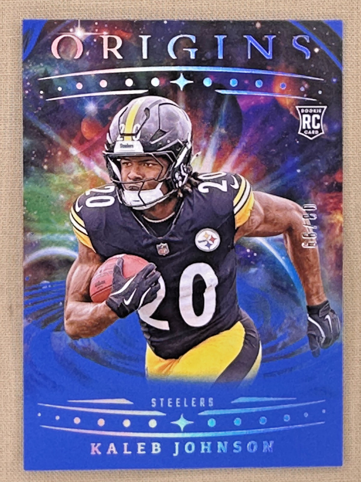2025 Panini Origins Kaleb Johnson RC Blue/99 Pittsburgh Steelers #104
