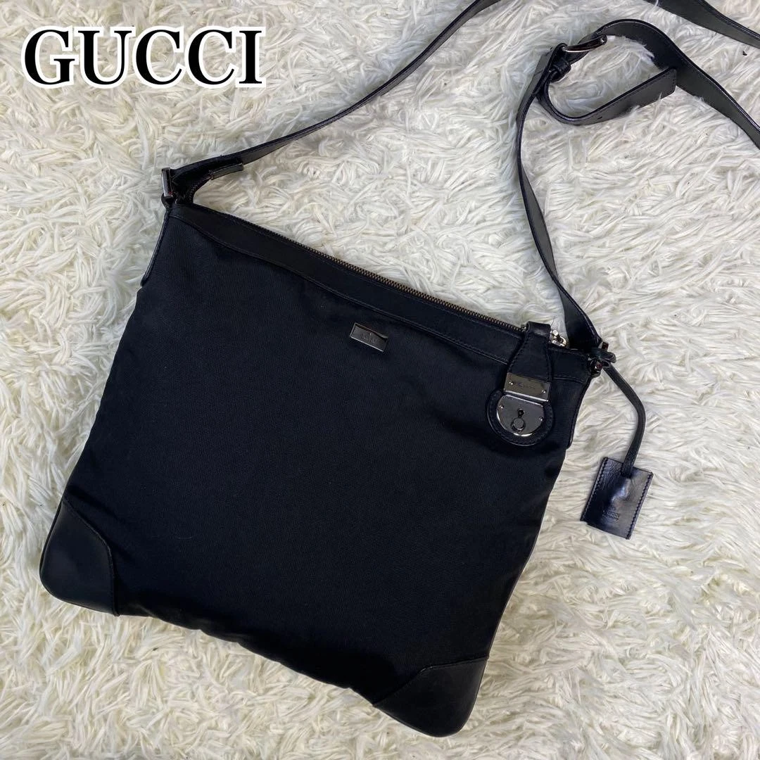 Sac bandoulière GUCCI toile cuir logo plaque noir