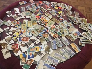 A vintage job lot of over 200 cigarette cards in used condition