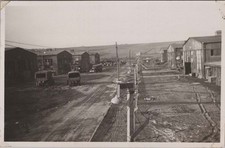 WW2 Photo of Military Trucks Lined Along Camp Roadway