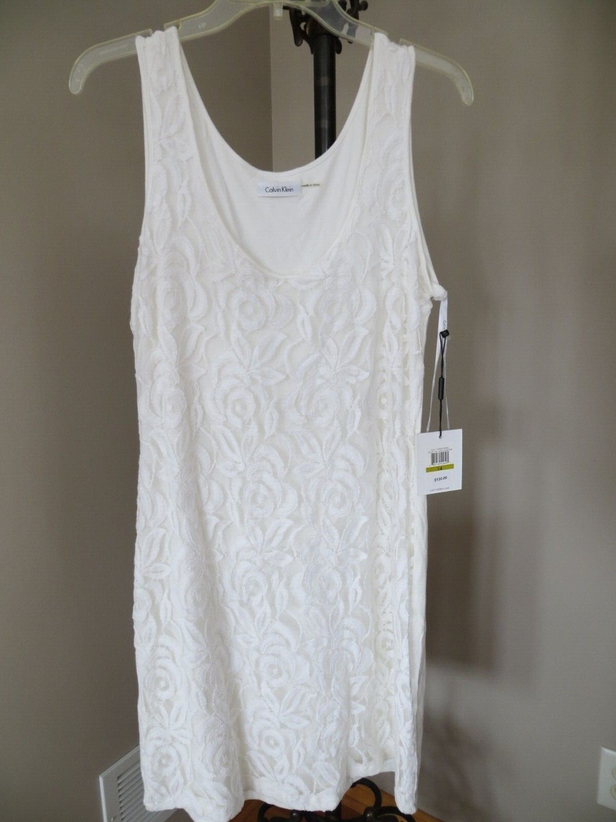 calvin klein white sleeveless dress Eyelet Midi This sleeveless dress is designed from smooth cotton rib in a midi length silhouette Calvin Klein White Sleeveless V-Neck