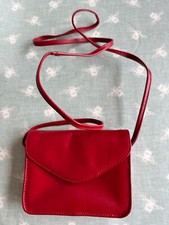Red Leather Bag Small Size. Hardly Used. Good Quality. Magnetic Clasp. 2 Zips.