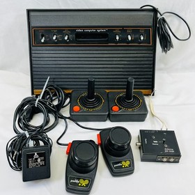 Atari 2600 Console Bundle: Joysticks, Paddles, Atari Force Comic, Organizer, Pin