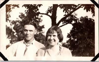 Vintage 1920s 1930s Snapshot Photo Young Couple Smiling Outdoors Trees Sepia