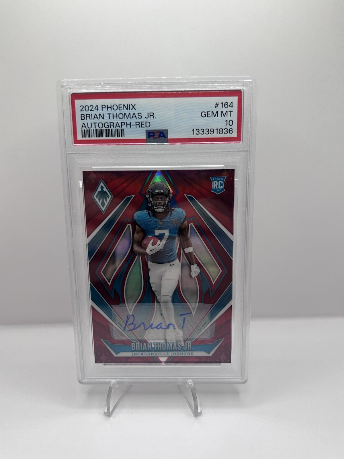 2024 Panini Phoenix - Rookies Brian Thomas Jr. #164 Red /99 (RC)