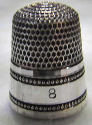 #408  FACETED BORDER STERLING SILVER THIMBLE - SIMONS BROS.CO. (SIZE 8)