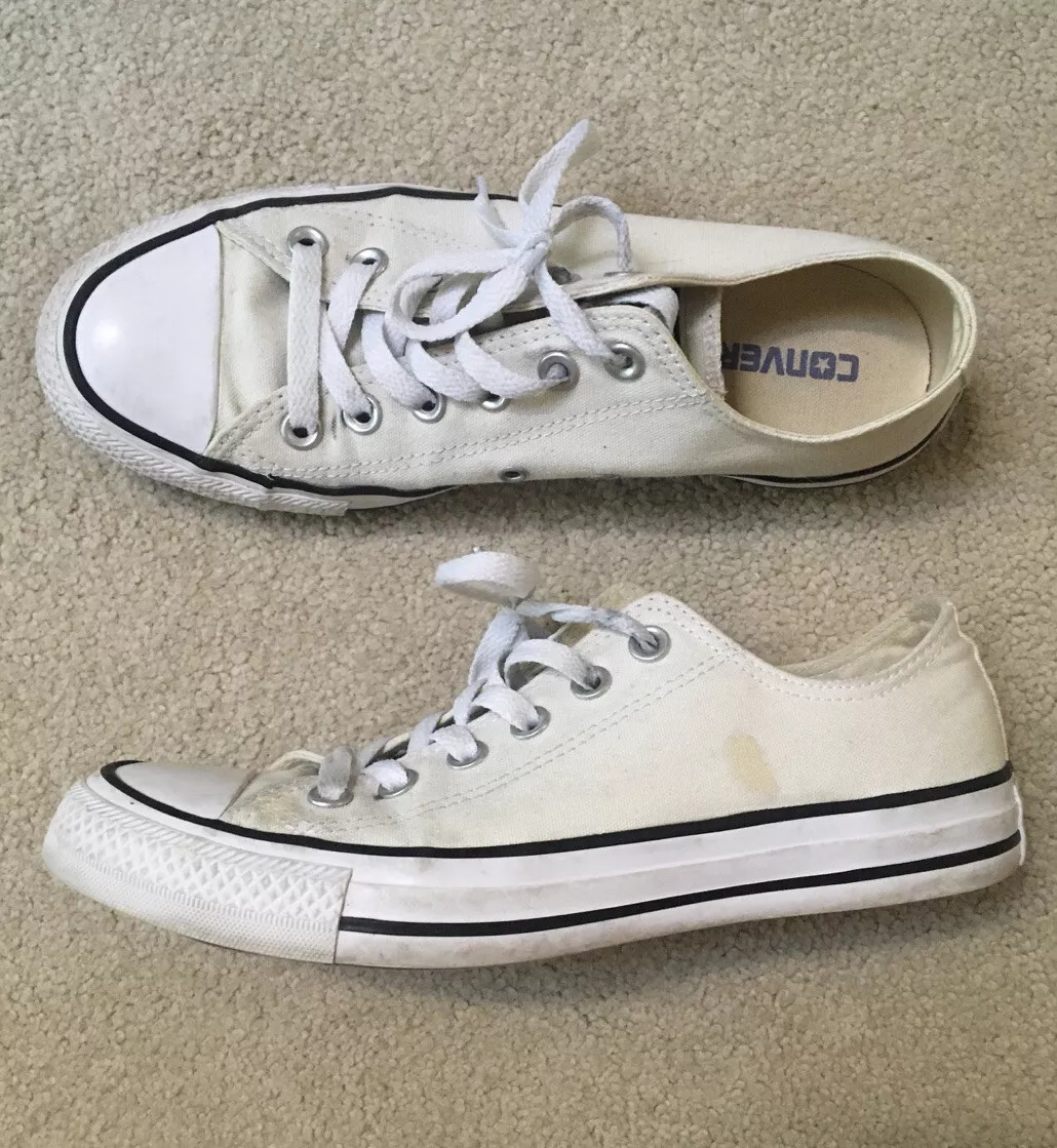 White low top best sale converse with black stripe