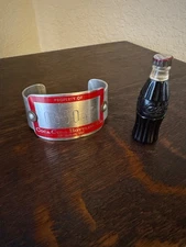 VINTAGE COCA-COLA  BOTTLE CIGARETTE LIGHTER & ALUMINUM COCA-COLA BRACELET LOT