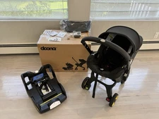 DOONA INFANT CAR SEAT WITH LATCH BASE SPECIAL MIDNIGHT EDITION WITH ACCESSORIES