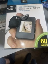 THE SHARPER IMAGE RECHARGABLE DIDITAL PHOTO ALBUM NIB