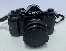 Vintage Canon A1 35mm SLR Film Camera with Accessories