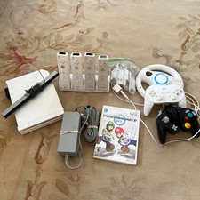 Wii Nintendo Mario kart game and console wheel remotes charging station