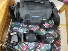 Canon Eos Rebel X 35mm film camera bundle with 2 zoom lenses, flash, and bag.