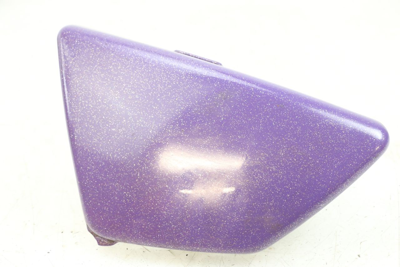 TAPA BAJO ASIENTO IZQUIERDA - SUZUKI GN 125 (1997 - 2000)