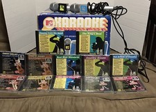 Karaoke - MTV-"The Singing Machine" SMGK-1000 WITH 12 DISC SOME NEW 2 MICROPHONE