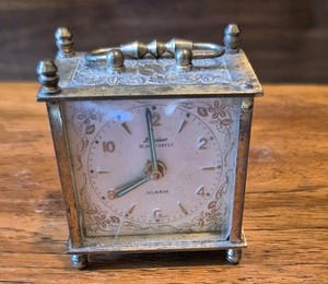 vintage Linden Black Forest mechanical travel alarm clock.