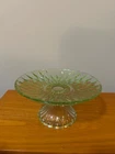 vintage green depression glass pedestal cake stand, likely from the 1930s or 194