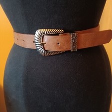 Western look belt. Brown with silver buckle . Fits waist 27 - 31 . 1 width x 35