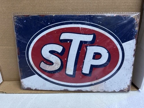 Vintage-style STP logo metal sign