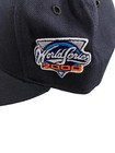 Navy New Era NY Yankees fitted hat with white embroidered World Series 2000 logo in blue, red, and white on the front panel.