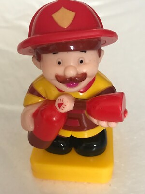 Vintage Plastic Fireman Toy Fire Extinguisher Red Hat Yellow Coat Square Base