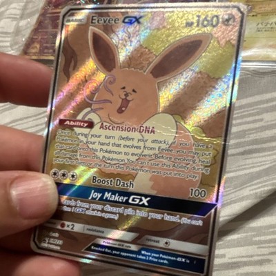 Pokemon TCG Eevee GX SM233 SM Promo Holo EN 160 HP Basic Pokemon Q-Rais Creased