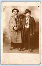POSTCARD RPPC Two Men Hats Ties Dirty Overcoat Shaking Hands AZO 1904-18