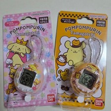 Set of 2 POMPOMPURIN Tamagotchi Basic Orange ver. and Magical Pink ver.