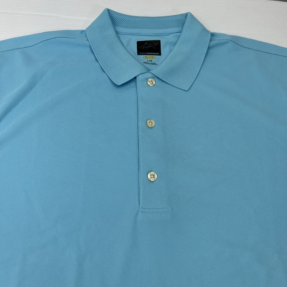 Polo Greg Norman Grande Azul Play Dry National Konica Minolta Golf Clásico Foto 3 de 4