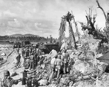 Troops and vehicles landing on shell torn World War II WWII WW2 8x10 Photo 810c