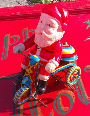 Vintage Walt Disney  Mechanical Tin and Celluloid Christmas Santa on Trike Toy