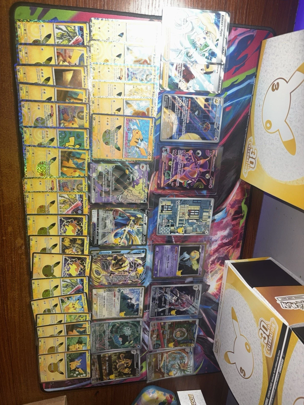 Binders and boxes of Pokemon cards on a shelf