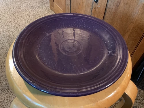 Pre Owned Fiesta plum 10.5”  Plate.  Contemporary. Some marks.