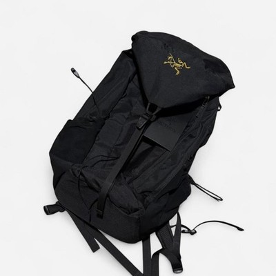 Black Arc'teryx Mantis 20 backpack with yellow embroidered logo