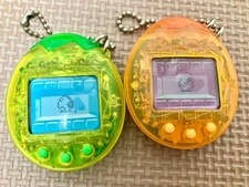 Bandai Tamagotchi Osutchi Mesutchi Clear Orange Clear Green Set of 2