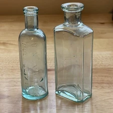 Set Of 2 Aqua Medicine Bottles - 1 x Dr. NC White’s Puly Elixir 1 x Marked T 4