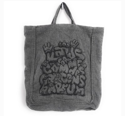 kaws x comme des garcons