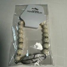 Fashion Jewelry Cream Beaded Stretch Bracelet Silver Tone Feather Charm