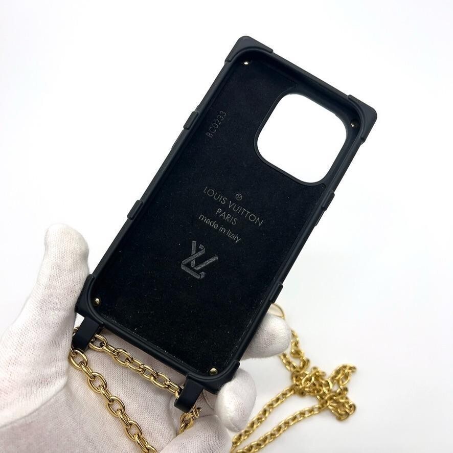 LOUIS VUITTON Monogram Embossed Retrunk iPhone 14 Pro Case LOUIS VUITTON Monogram Embossed Retrunk iPhone 14 Pro Case