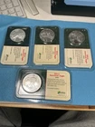Lot of (4) 2001/02/04/05 American Eagle Littleton Showpak BU 1 oz .999 Silver