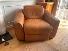 reclining soft tan leather armchair