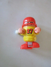 Vintage TOMY wind up football player