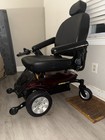 Pride Mobility Elite ES Powerchair, Black/Red, Swivel Seat, Padded Armrests — photo 1