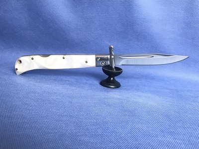 Unique folding pocket knife with 440C steel blade.