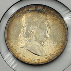 1951 P Franklin Half Dollar with peripheral toning and light rainbow qualities